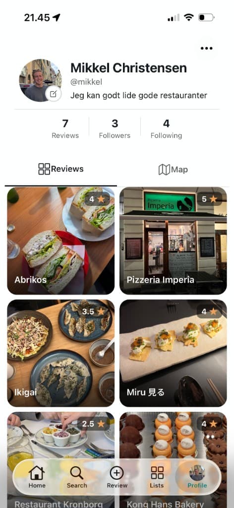 Profile screen showing a grid of restaurant reviews with photos and star ratings.
